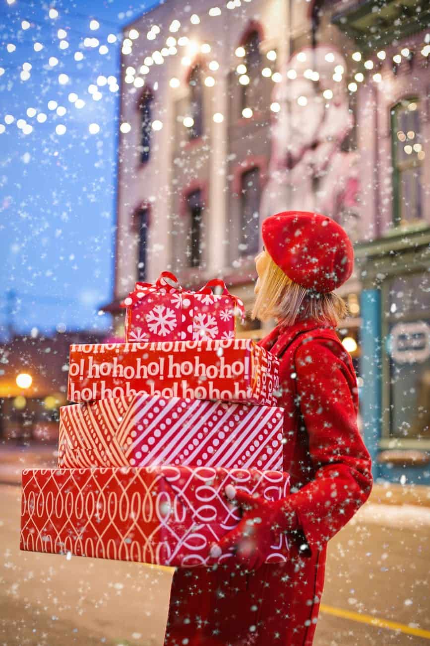 woman carrying christmas presents