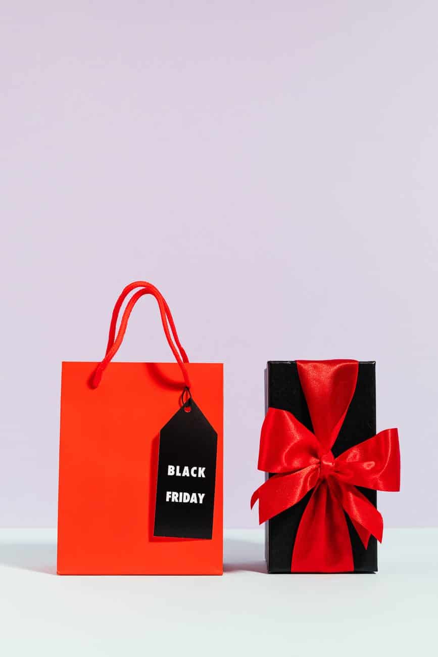red paper bag beside a present
