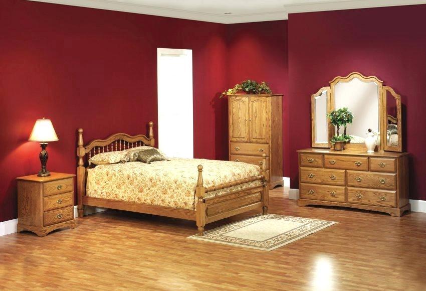 burgundy bedroom with dark wood furniture